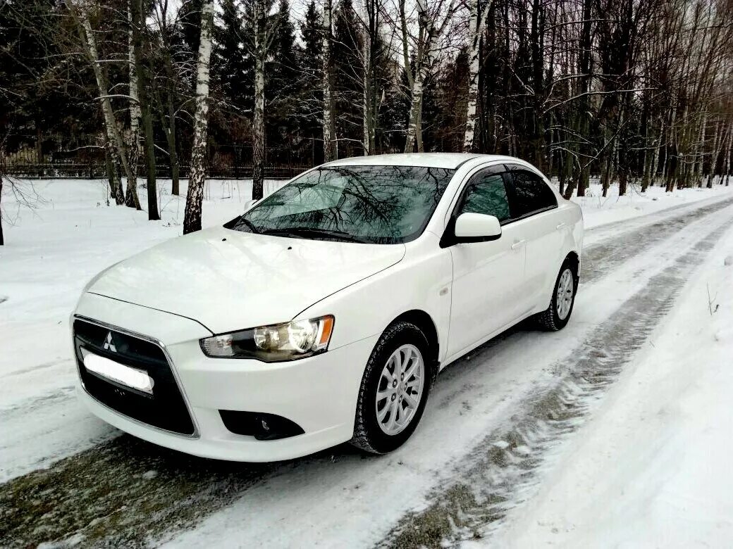 Mitsubishi lancer 2012. Mitsubishi Lancer 10 2011 белая. Митсубиси Лансер 2011 белый. Мицубиси Лансер 2011 белая. Mitsubishi Lancer, 2011 белый.