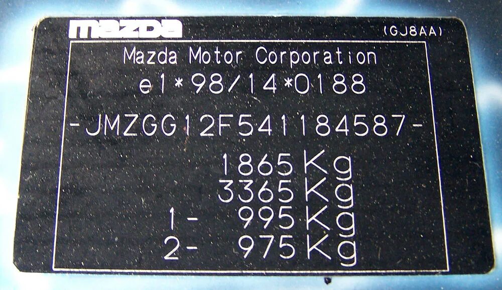 Mazda вино. Mazda CX 5 VIN табличка. Mazda 2 2003 VIN. Mazda CX 7 вин номер. Mazda CX-7 табличка VIN.