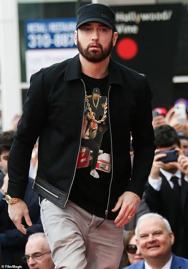 Man in Black Hat and Leather Jacket Making Peace Sign