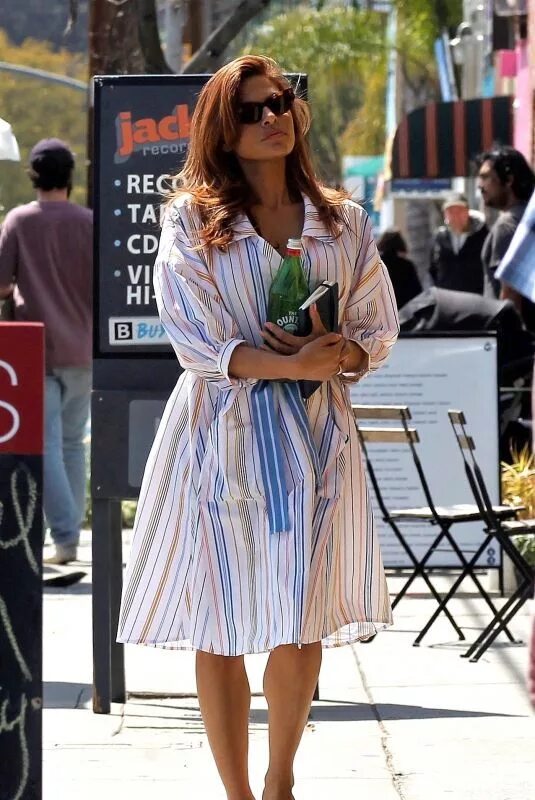 Getting ready to nest? Eva Mendes slips her curves into a VERY tight pencil skir