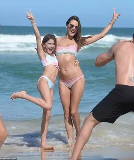 Alessandra was joined on the beach by her daughter Anja Louise who donned a...