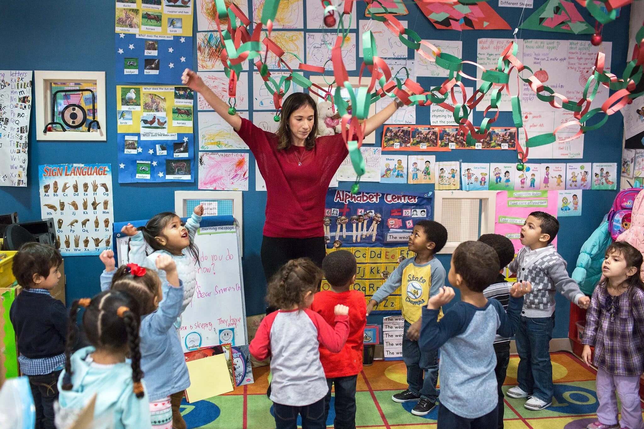 Preschool teachers. Teacher Preschool language children standing. Dance Preschool teacher. Teacher Preschool language children take photo.