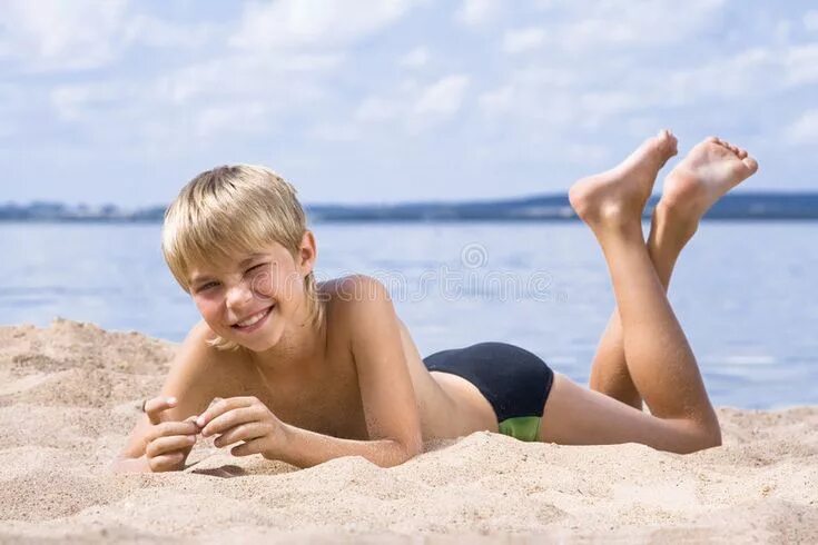 Boy and girl playing with beachball on beach. фотография Stock Adobe Stock