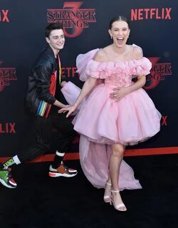 Noah seen with his co-star Millie Bobby BrownCredit. 