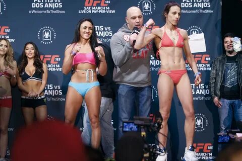 Joanna Jedrzejczyk flexes during the UFC 185