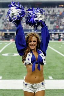 member of the Dallas Cowboys cheerleaders performs during an NFL football g...