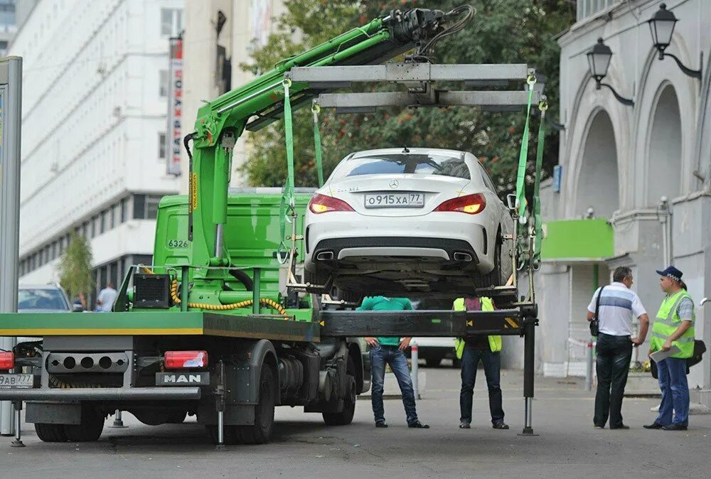 Автомобиль эвакуация автодруг. Man TGL 12.180 эвакуатор. Московский эвакуатор ЦОДД. Грузовой эвакуатор ман ЦОДД. Московский паркинг эвакуатор man TGL.