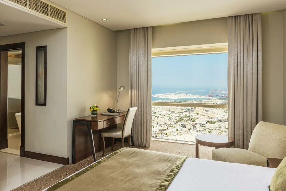 Millennium plaza hotel) 5* (всемирный торговый центр). Тауэр плаза отель дубай. Millennium plaza hotel dubai 5. Millennium plaza hotel 5. Отель the tower plaza hotel dubai 5*.