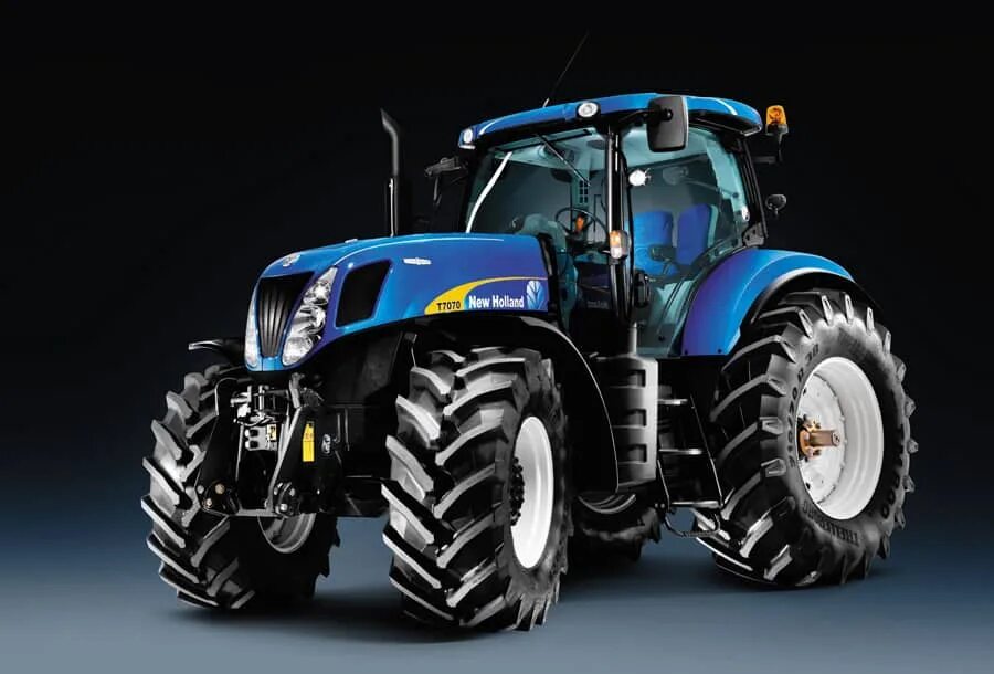 New holland t. New Holland t7000. Трактор New Holland t7060. Колесные трактора Нью Холланд. Трактор Нью Холланд т7050.