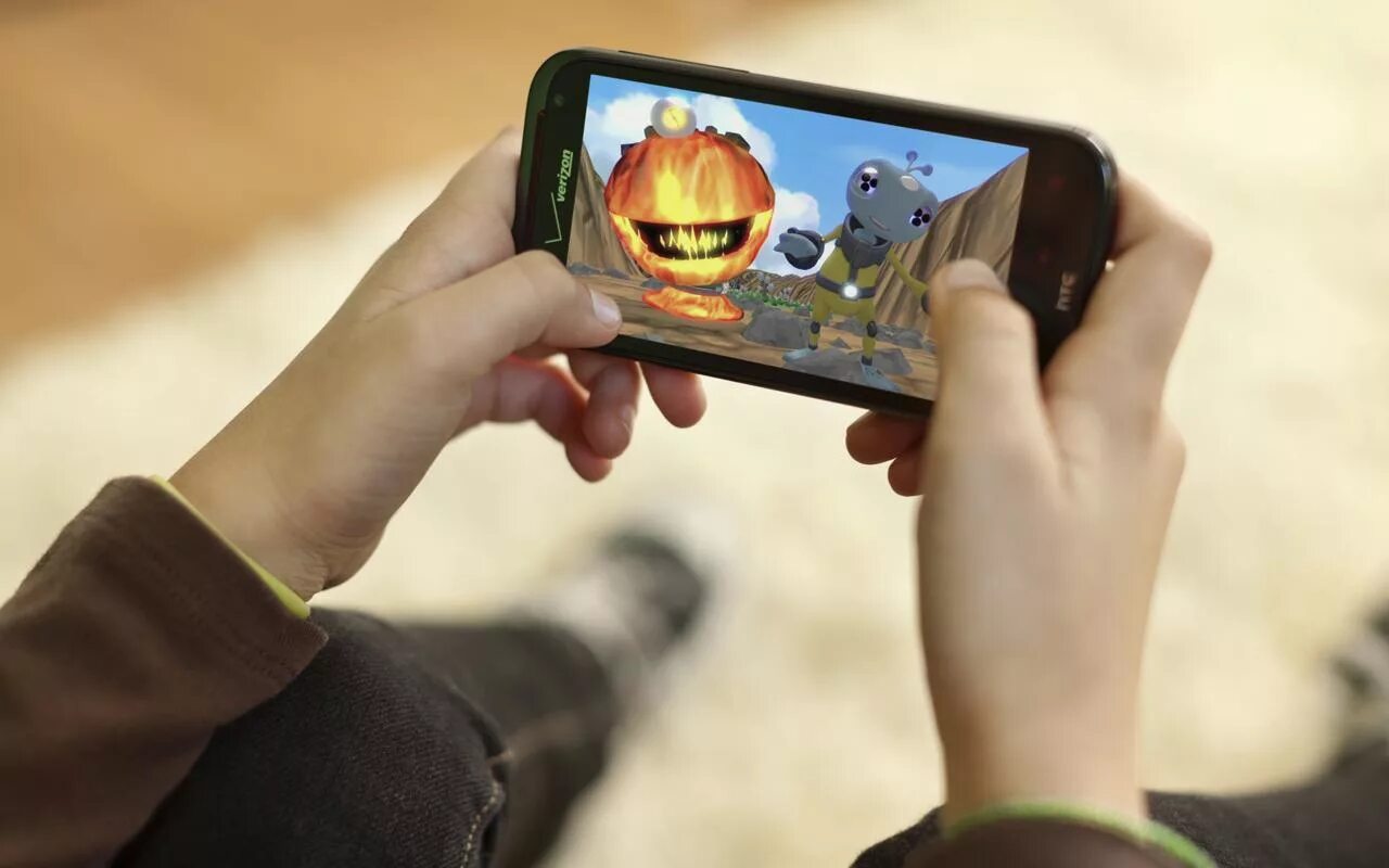 Playing mobile games. Playing mobile games