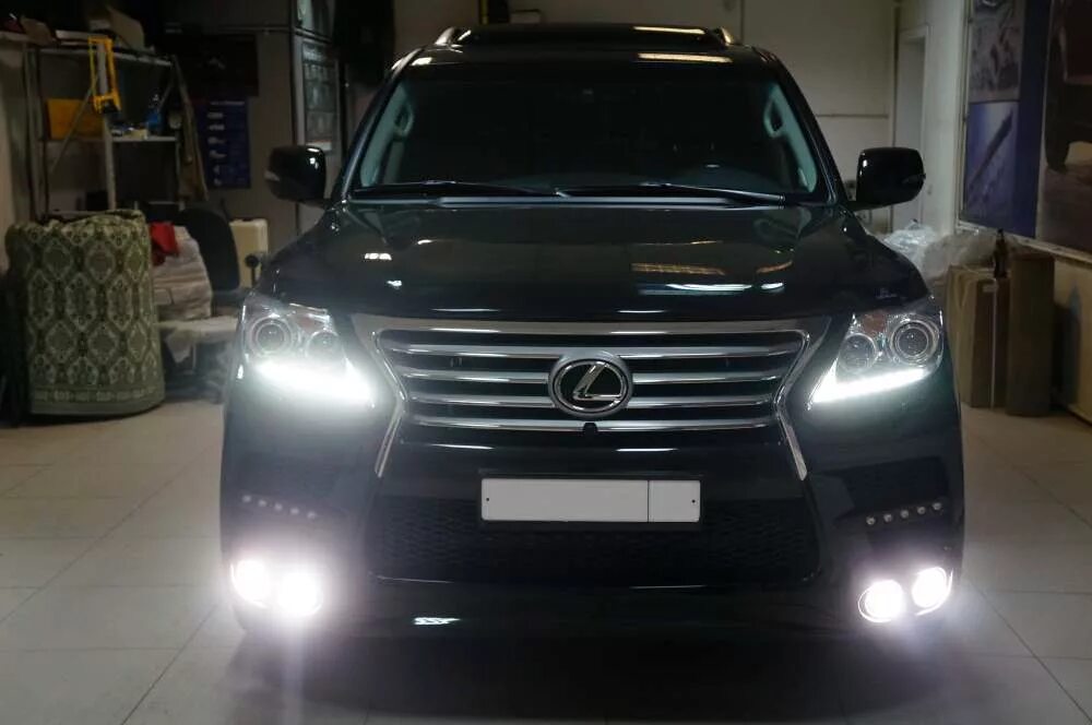 Lexus lx фара. Lexus lx 570 2012. lexus lx570 2012 black. lexus lx 570 2012 черный. лексус 570 2015 тонированный.