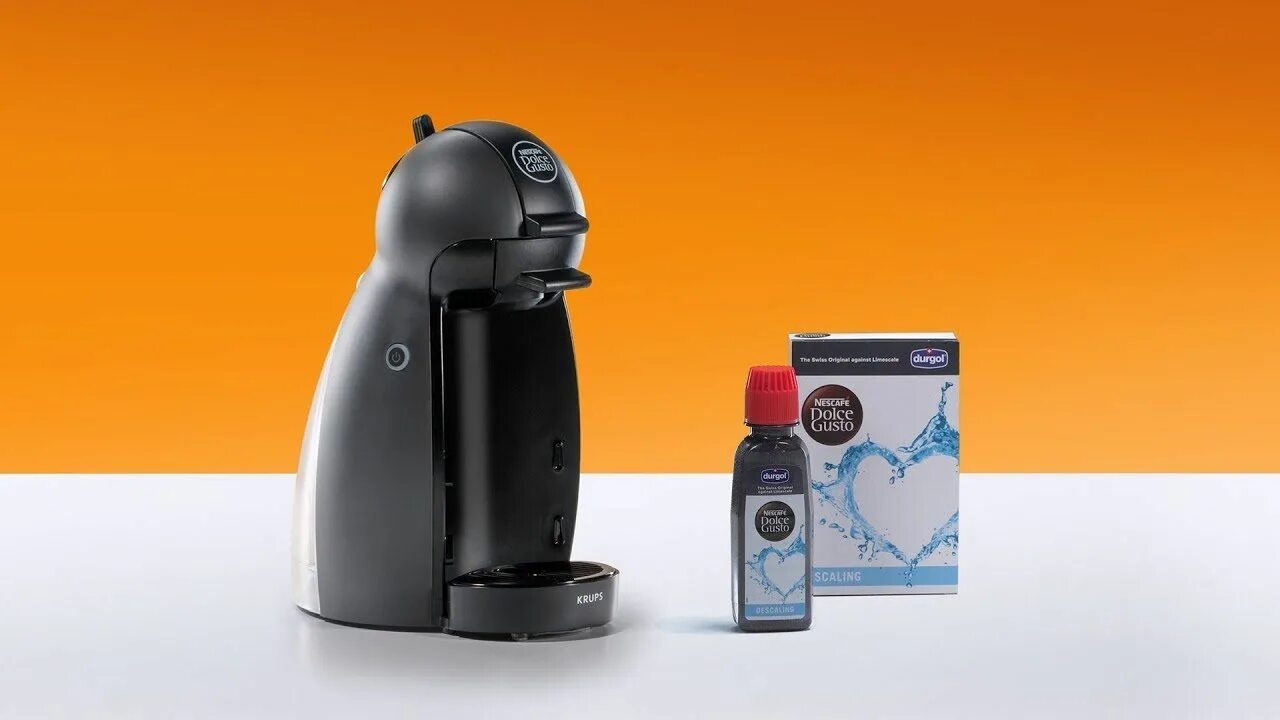 Dolce gusto накипь. Nescafe Dolce gusto. Чистка кофемашины Дольче густо. Delonghi Dolce gusto banner. Кофемашина Krups Nescafe очистка от накипи.