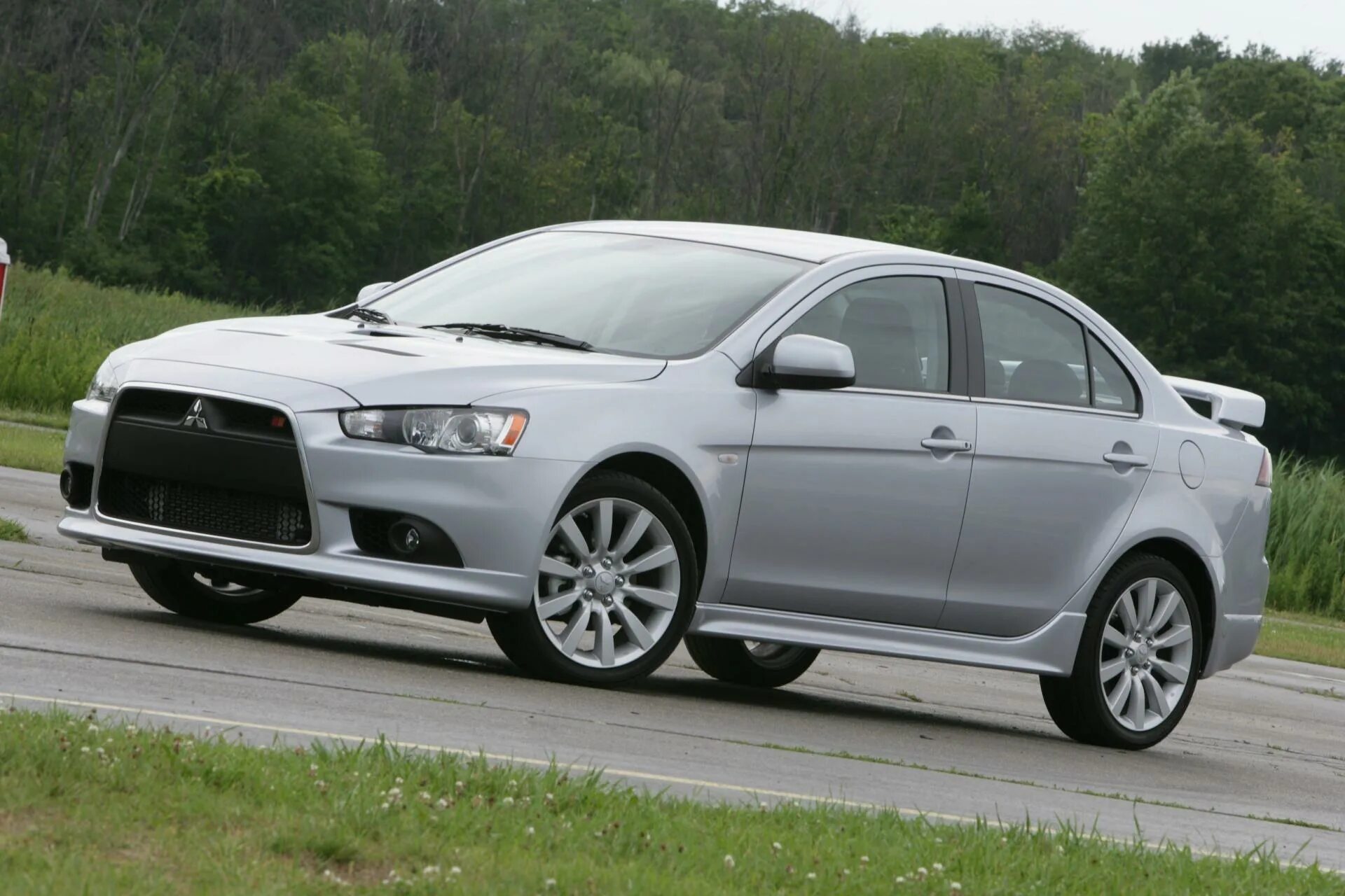 Mitsubishi lancer отзывы. Mitsubishi Lancer 2011. Мицубиси Лансер 10. Мицубиси Лансер x 2010. Митсубиси Лансер 10 раллиарт.