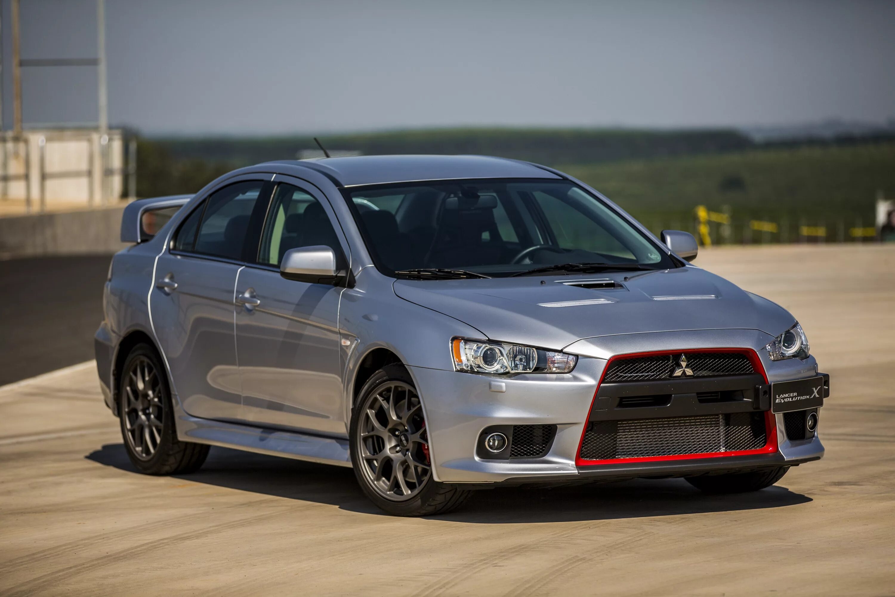 Мицубиси 10. Mitsubishi Lancer Evolution x 2014. Mitsubishi Lancer Evolution 10. Митсубиси Лансер Эволюшн 20. Митсубиси Лансер 10 EVO.