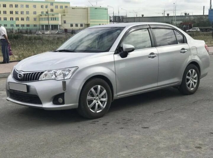 Продаже тойота аксио. Toyota Axio Luxel. Corolla Axio Luxel 2011. Тойота Аксио 2010 люксель. Руль Аксио люксель.