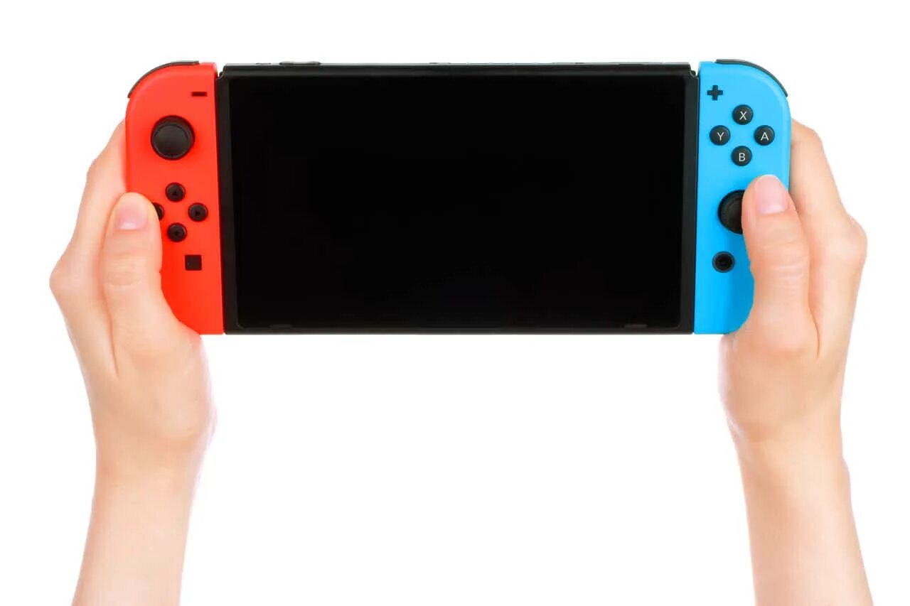 A switch is. Nintendo switch в руках. приставка нинтендо свитч в руках. приставка в руках. держит нинтендо свитч.