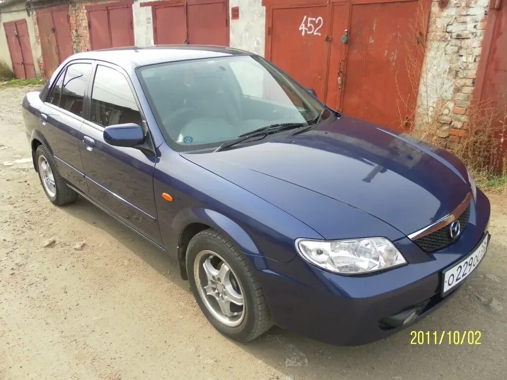 Mazda фэмили 2001 года. Mazda 323 2001. Mazda 323 bj 2001 седан. 8. 5 at, 2001.