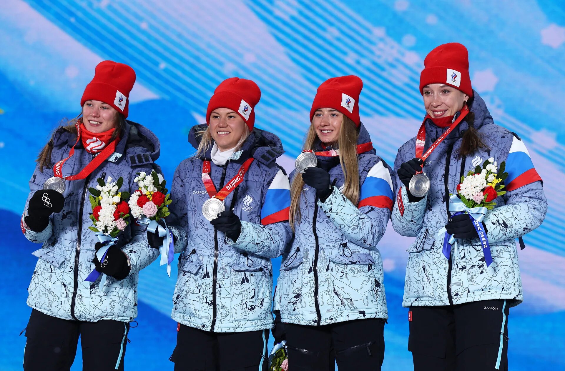 На зимней олимпиаде сборная. Женская сборная России по биатлону 2022. Женская сборная по биатлону на Олимпиаде 2022.