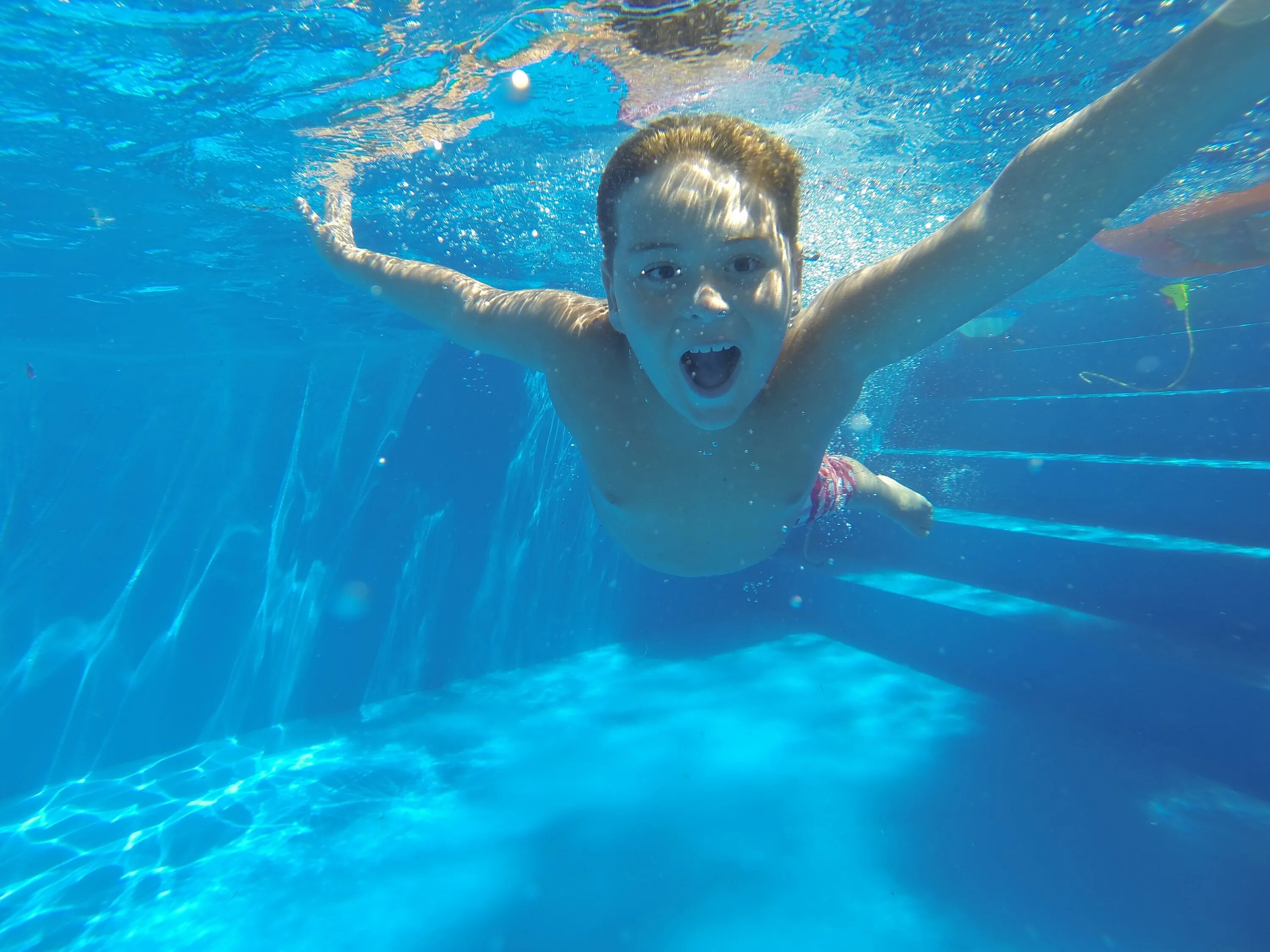 He swims in the pool