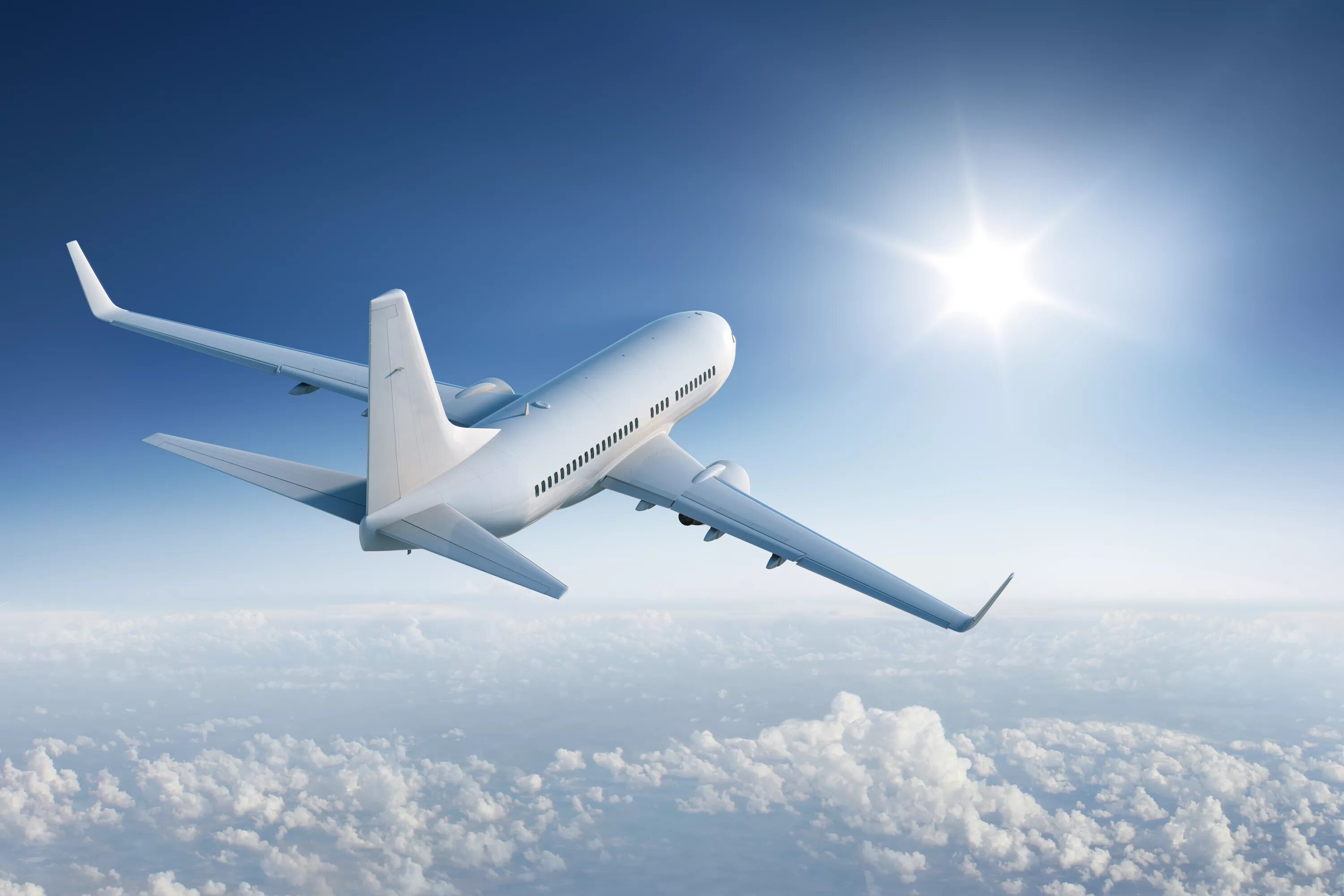 Самолет. Самолет в голубом небе. Пассажирский самолет. Белый самолет.