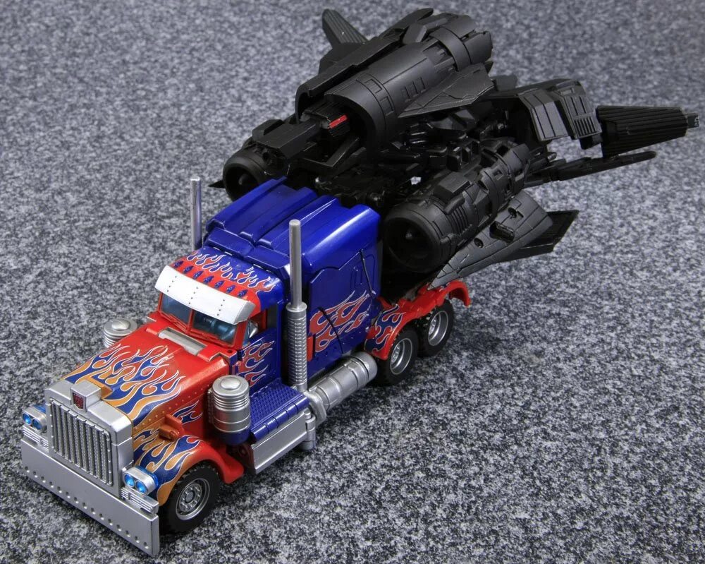 Оптимус прайм игрушка трансформер большой. Jet optimus prime. Jet optimus prime. Трансформеры 3 игрушки оптимус прайм. Джет optimus трансформер.