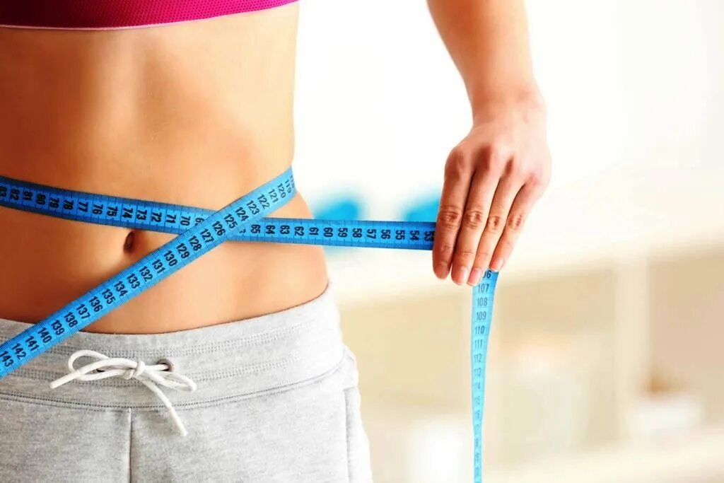 Slim diet. Для похудения. Девушка с сантиметром. Измерить талию. Slim diet.