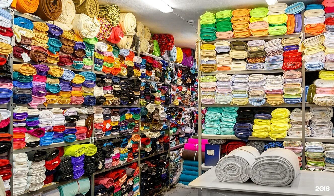 фантазия магазин трикотажа для дома. трикотаж ткань. текстильные товары ассортимент. однотонные трикотажные ткани реклама. рулон ткани.