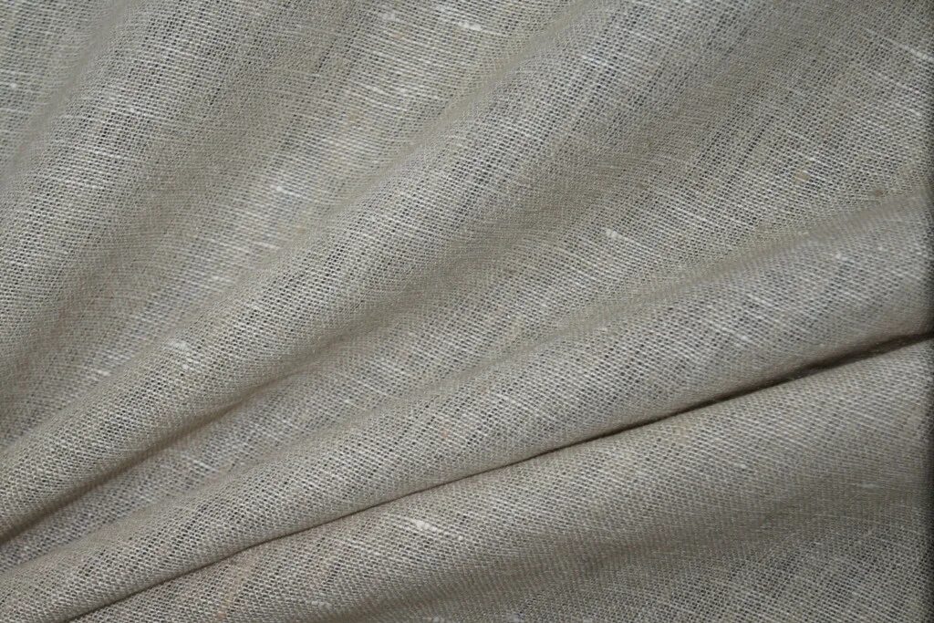 льняная ткань. льняная ткань. цвет натурального льна. натуральные ткани. натуральный лен.