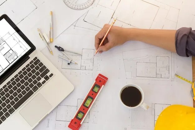 Blueprints of designer and engineers working at architects office. фотография St