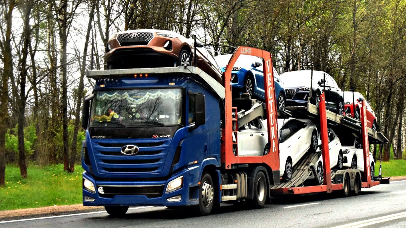 Ввоз легкового автомобиля. Автовоз Хендай Xcient. Скания тягач автовоз. DAF LF автовоз. Автовоз КАМАЗ 941300.