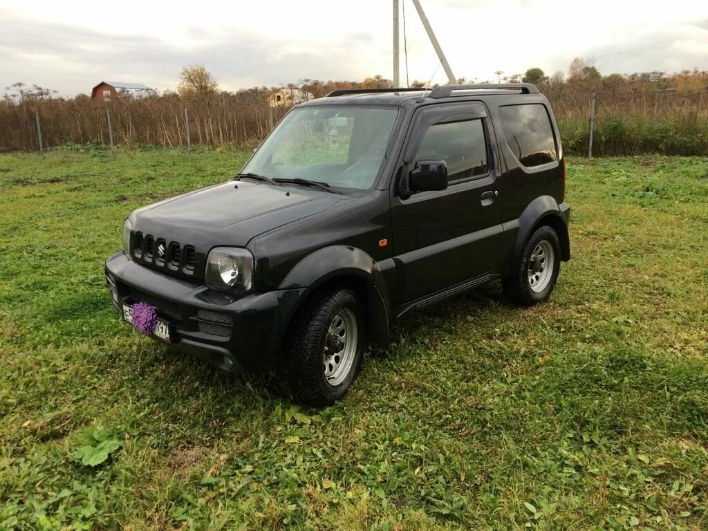 Купить сузуки джимни москва и московская. Suzuki Jimny черный. Suzuki Jimny 2004. Сузуки Джимни 2008 черный. Сузуки Джимни черный 2012.