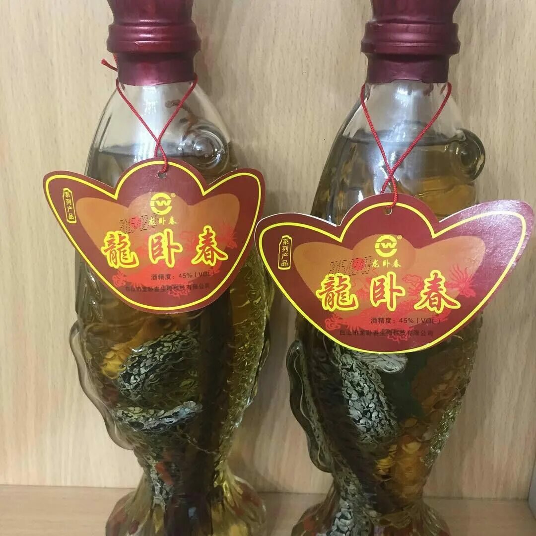 Китайская водка со змеей и женьшенем. Китайская водка со змеей и женьшенем. Китайская настойка со змеей и корнем женьшеня. Китайская водка с женьшенем. Китайская водка с женьшенем.