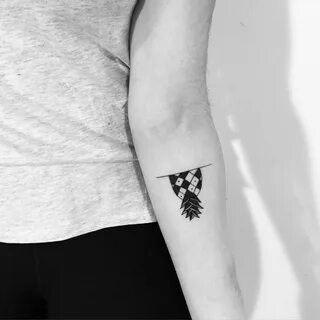 Upside down pineapple by Chinatown Stropky tattooed on the left forearm Ups...