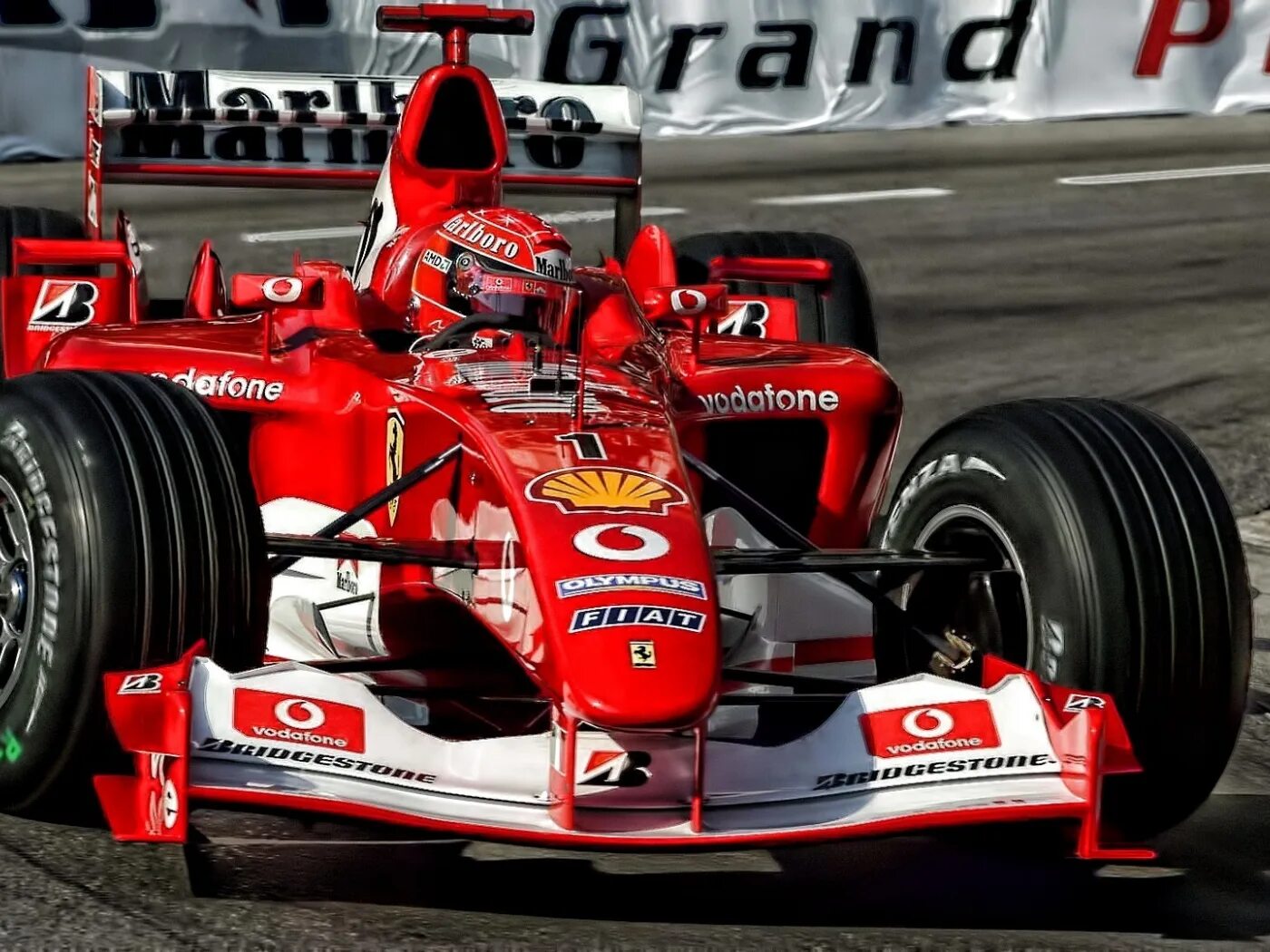 Формула 1 50. Михаэль Шумахер Ferrari f2004. Формула 1 Михаэль Шумахер. Болид Феррари Михаэля Шумахера. Ferrari f2003-ga.