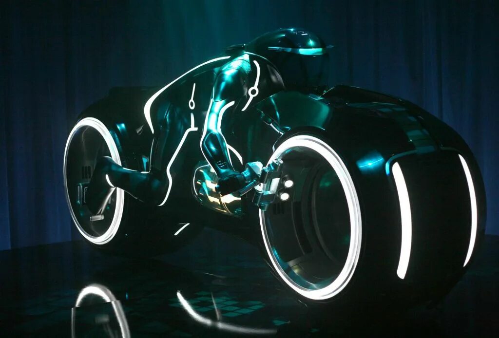Беговел в стиле трон. Tron bike. Tron legacy 2010. Tron bike. Мотоцикл tron light cycle.