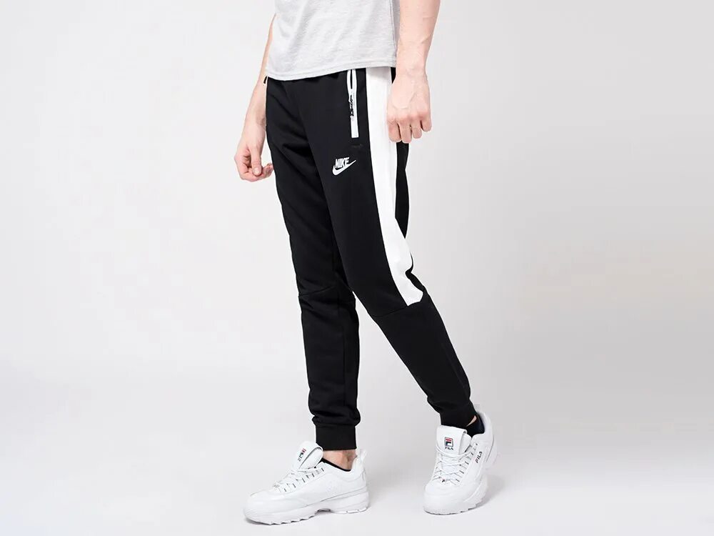 Nike Sportswear штаны чёрные спортивные мужские. Штаны Nike черные. Штаны найк с лампасами мужские черные. Спортивные штаны найк мужские черные. Черные спортивные найк