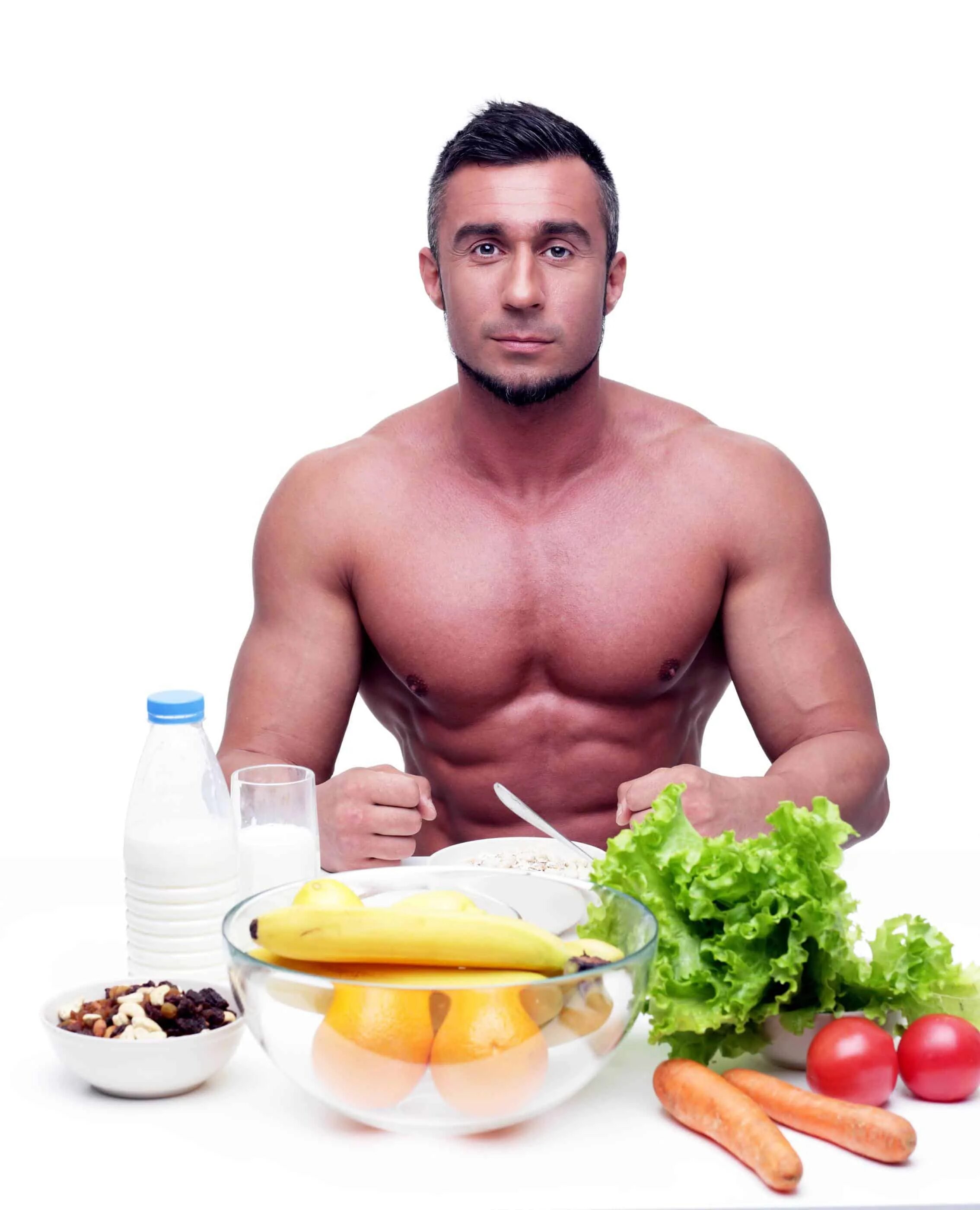 Здоровое питание для мужчин. Мускулистый мужчина за столом. Красота и здоровье мужчины. Полноценный обед мужчин.