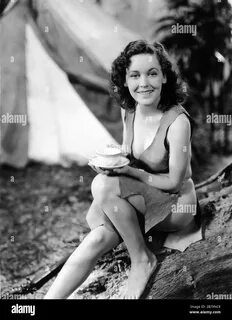 MAUREEN O'SULLIVAN as Jane Parker on set candid wearing sunglasses wit...