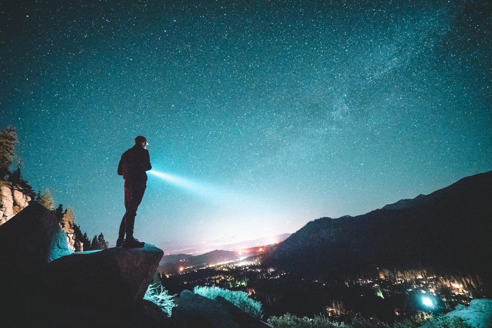Light up the. Hiking at night. фонарь smiling shark 867a. man with flashlight. flashlight scene.