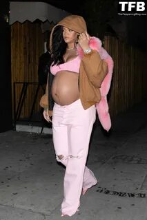 Pregnant Rihanna proudly shows off her growing baby bump as she rocks all p...