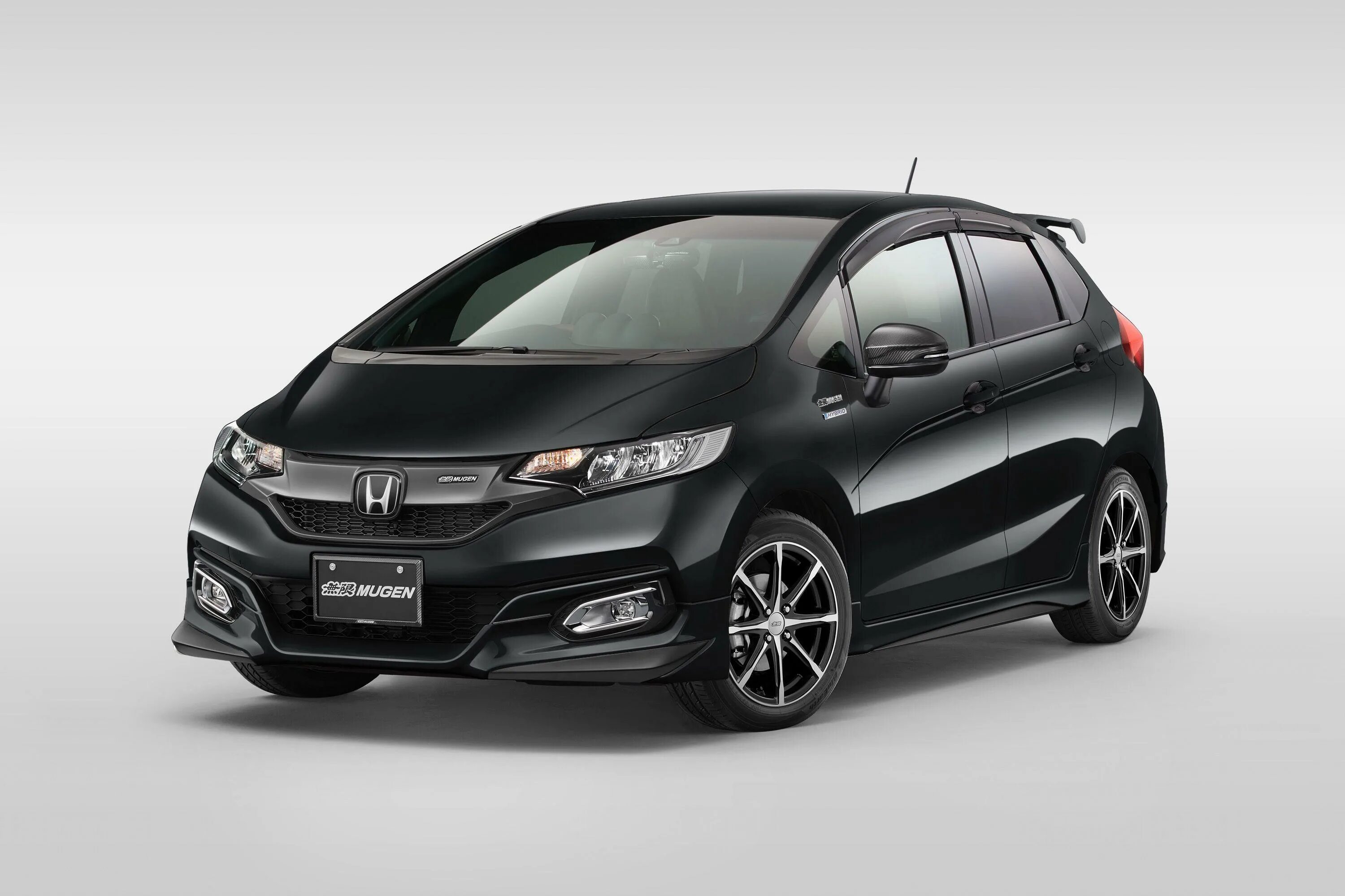 Хонда гибрид 2017. Honda Fit 2018 Hybrid. Honda Fit 2017 гибрид. Хонда фит гибрид 2018. Хонда фит 2017 черная.