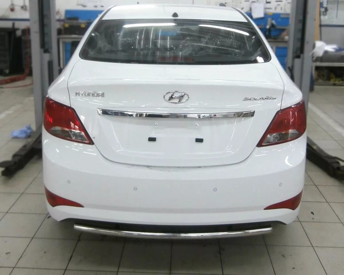 Hyundai solaris (2014-2017). Хендай солярис задний. Hyundai solaris 2014 седан. Бампер задний хендай солярис 2011. Хендай солярис задний.