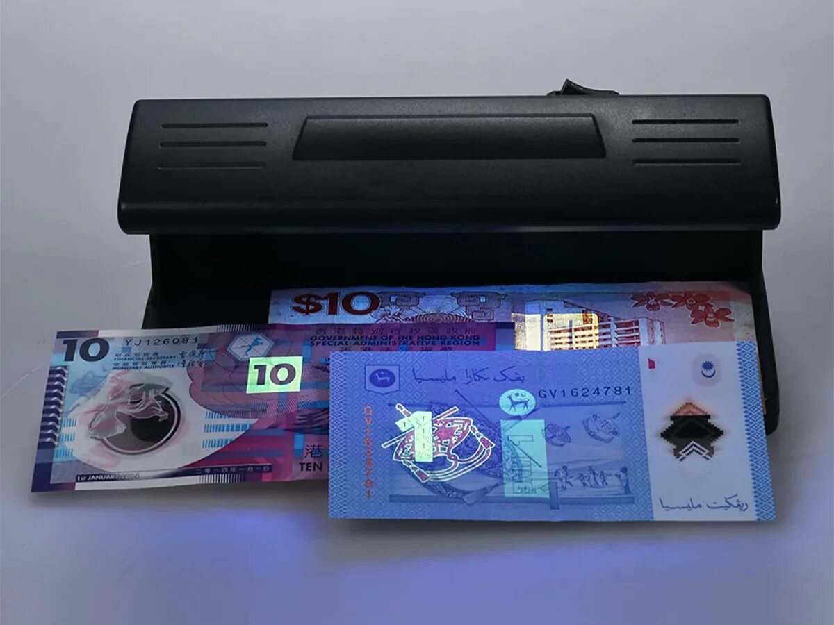 Аппарат для проверки денег counterfeit. Ультрафиолетовый аппарат для проверки денег. Ультрафиолетовые детекторы фальшивых купюр. Проверка купюр ультрафиолетом.