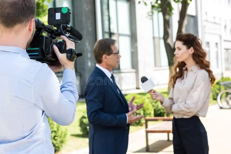 Listen to a reporter interviewing. Cameraman stock. reporter&#039;s interview recording.