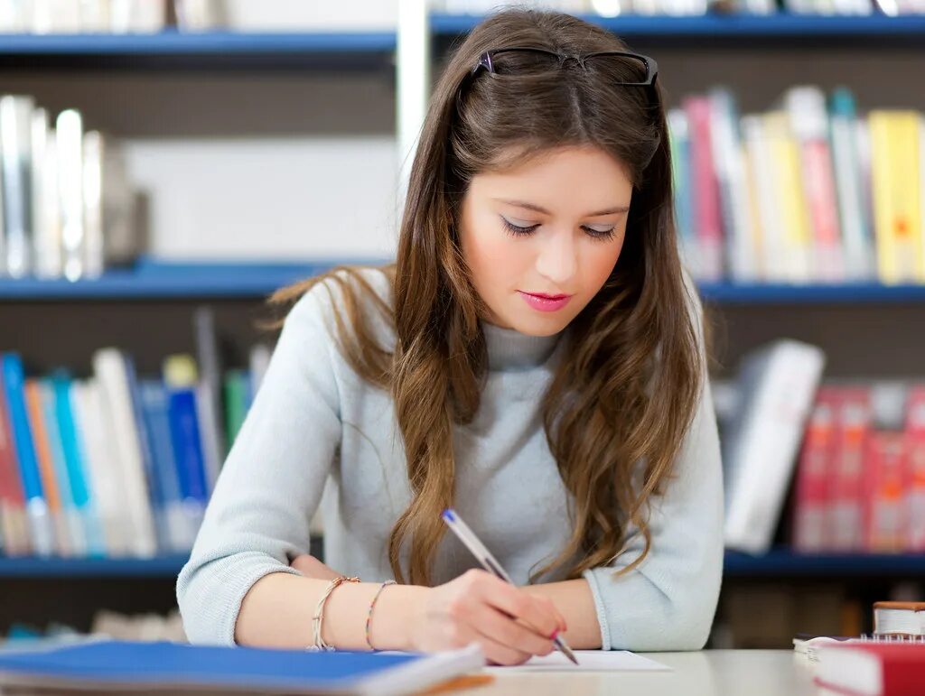 Dissertation writing. Dissertation writing. Человек за столом. Study at ul. Student doing homework.