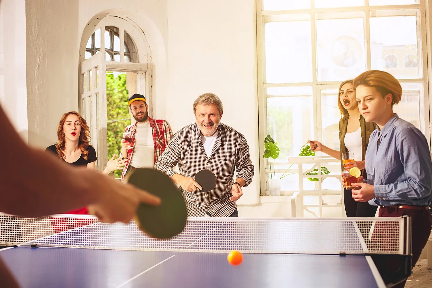 Tables my friends. Happy friends play ping pong.
