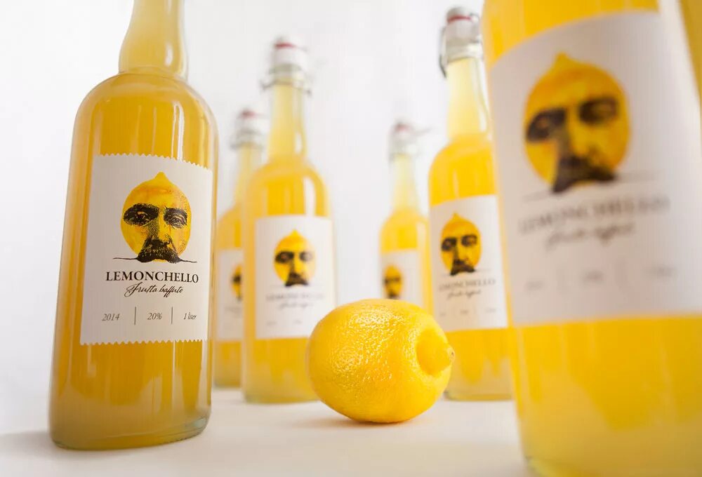 Бутылка лимончелло. Лимонный ликер Лимончелло. Лимонный ликёр Limoncello. Ликер Лимончелло этикетка. Лимончелло фруктовые ликёры.