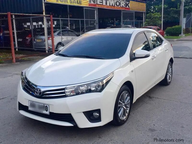 Toyota Corolla 2014 белая. Toyota Corolla 2014. Тойота Королла 14 года. Toyota Altis Corolla 2014 ~ 2018.