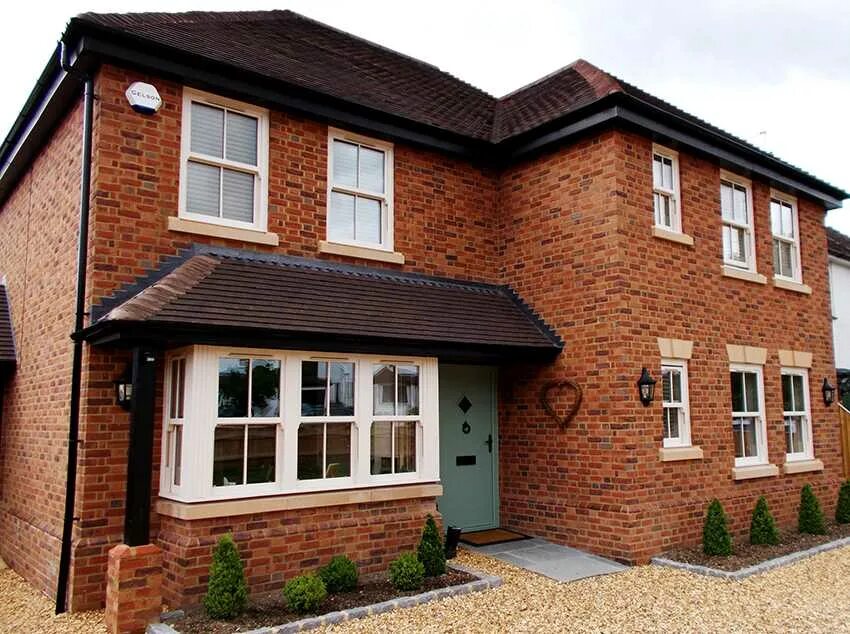 Фасад кирпичного дома. Обшивка кирпич. Сайдинг под кирпич альта профиль. Облицовочный материал для фасада. Отделка сайдингом под кирпич.