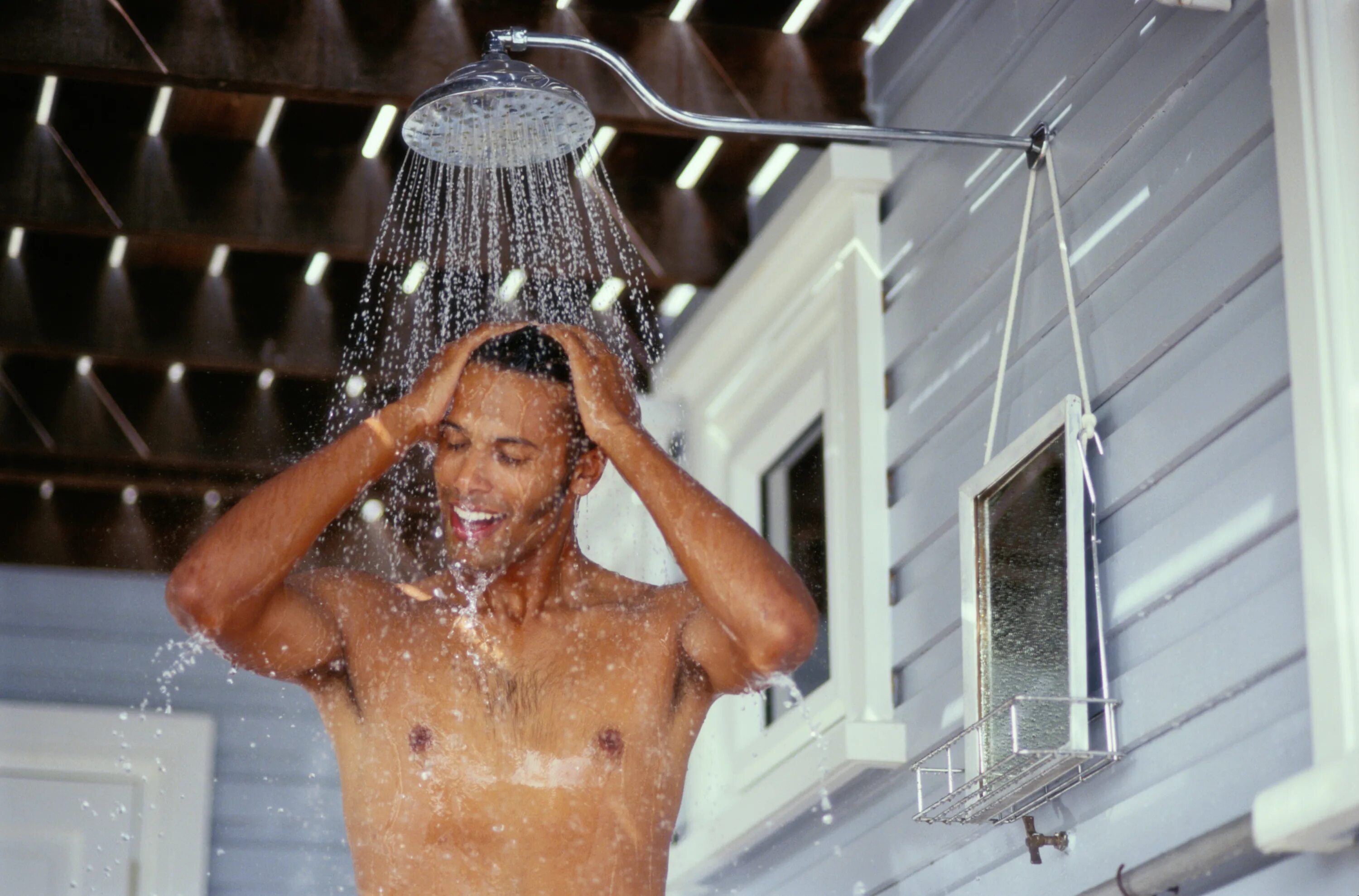 Black man in Shower.